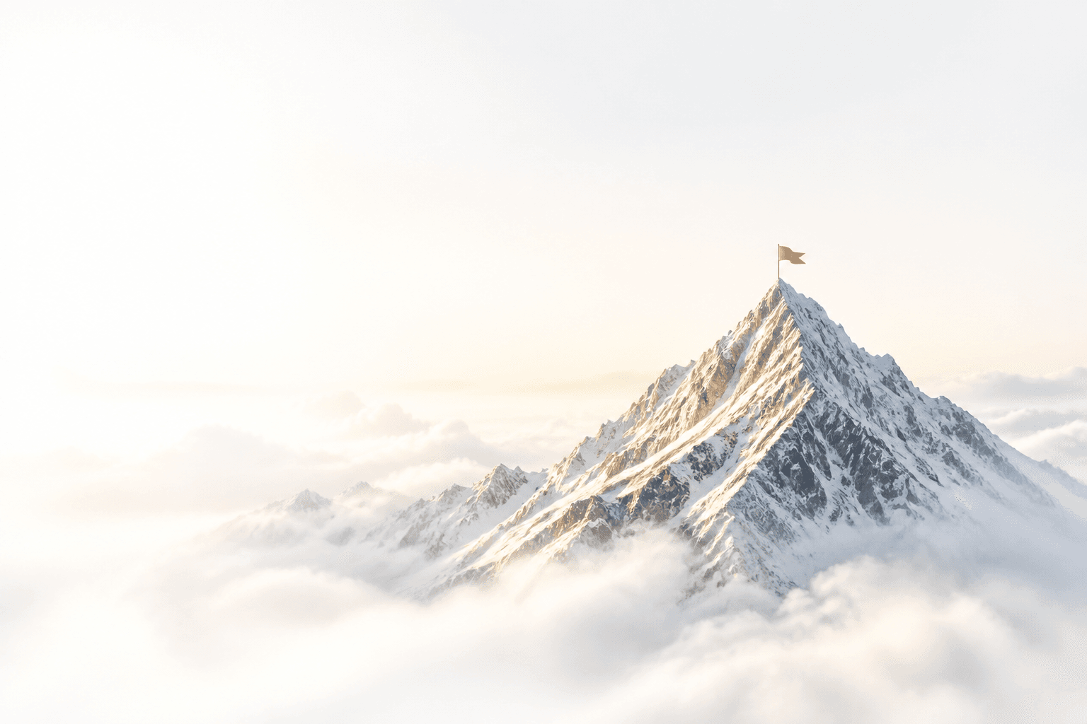 Snowy mountain summit above the clouds